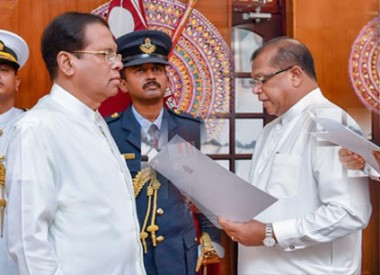 
Three new ministers, including one state minister, were sworn in before President Maithripala Sirisena at the President's residence in Colombo today.

Public Administration and Disaster Management Minister, Ranjith Madduma Bandara, was sworn in as Minister of Rural Economic Affairs.
